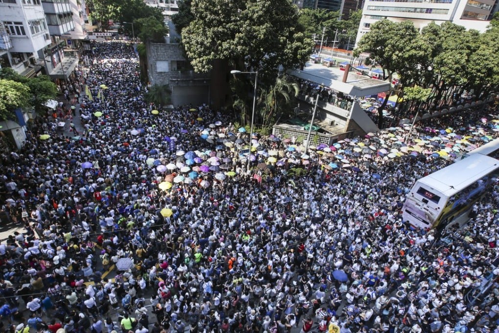 Thousands of Hongkongers hit the streets in the blazing heat on Sunday. Photo: David Wong