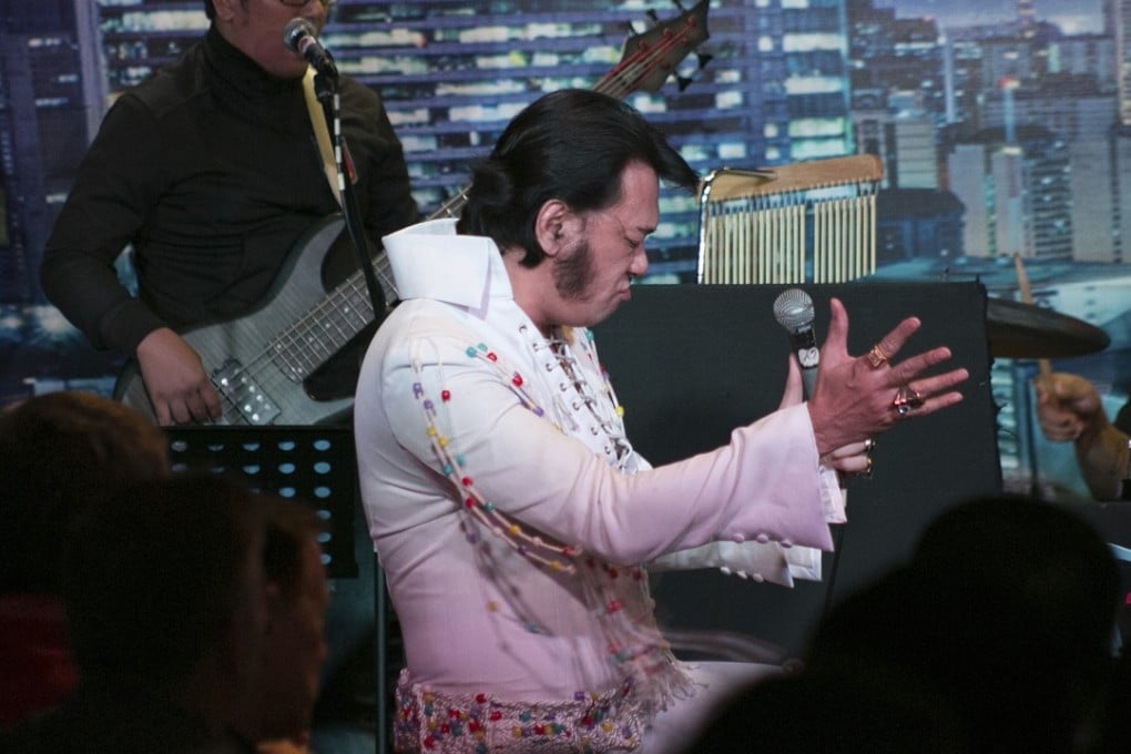 Elvis impersonator Jun Espinosa performs on stage in Manila. Photo: AP