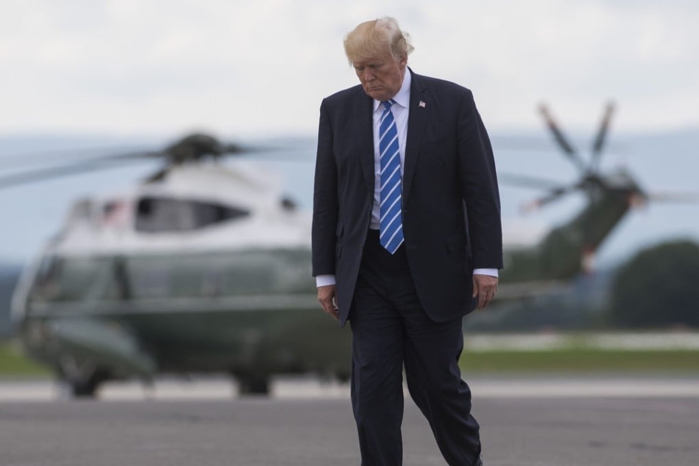 US President Donald Trump walks from Marine One to board Air Force One. Photo: AFP