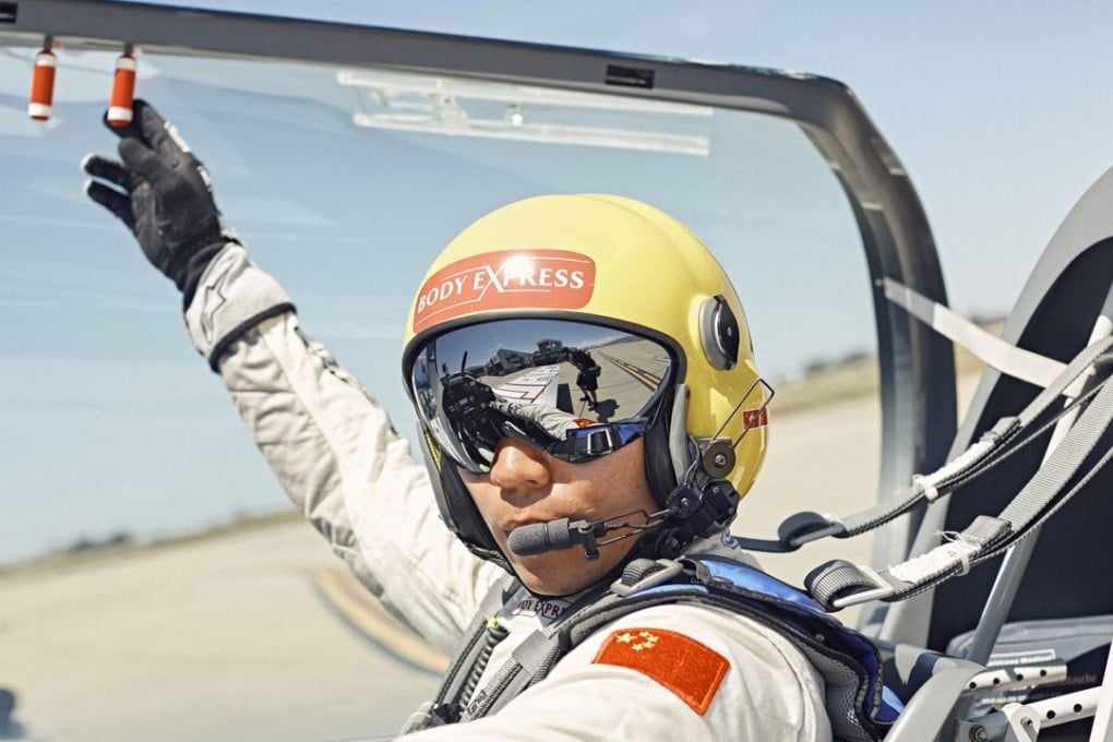 Kenny Chiang sits in the cockpit of his plane before his race. Photos: Red Bull