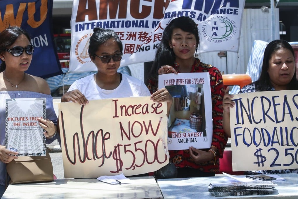Domestic helpers campaign on Sunday for a rise in their minimum monthly pay from HK$4,310 to HK$5,500. Photo: David Wong