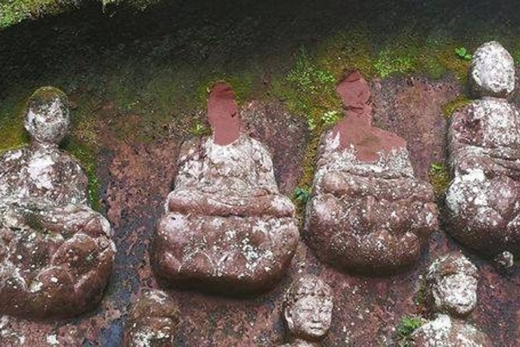 Police are investigating the disappearance of 10 Buddha heads from a stone relief in southwestern China. Photo: Handout