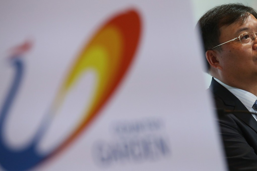 President and executive director Mo Bin says Beijing’s capital outflow and overseas investment controls haven’t affected their business. Photo: K. Y. Cheng