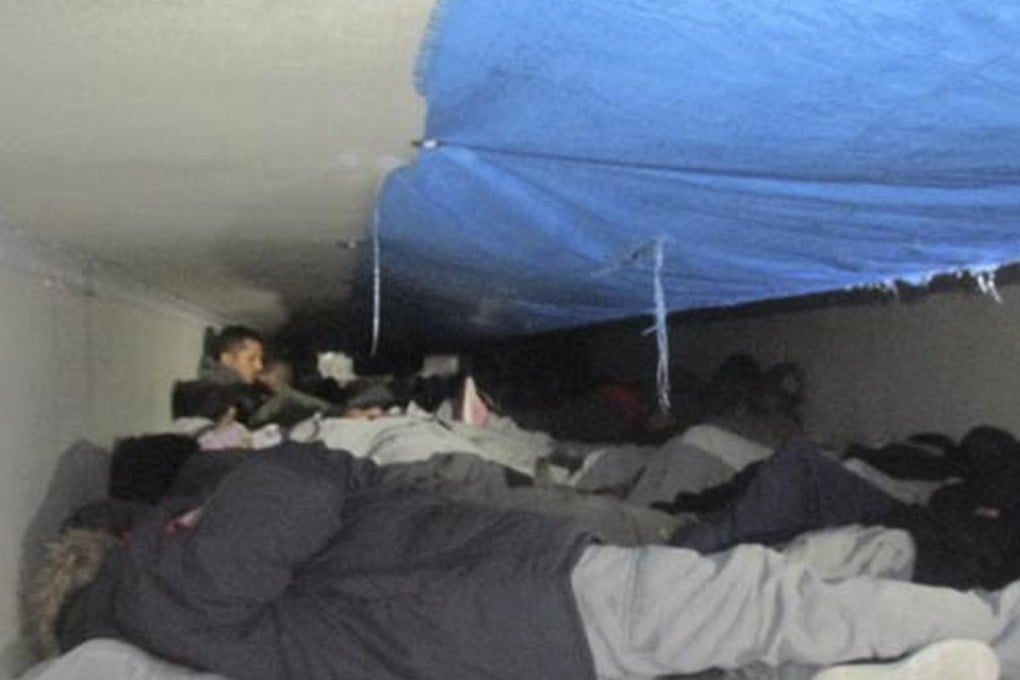A photo provided by US Customs and Border Protection shows immigrants found in a load of ice-covered broccoli in a refrigerated trailer that was searched at a South Texas border checkpoint in Falfurrias, Texas. Photo: US Customs and Border Protection via AP