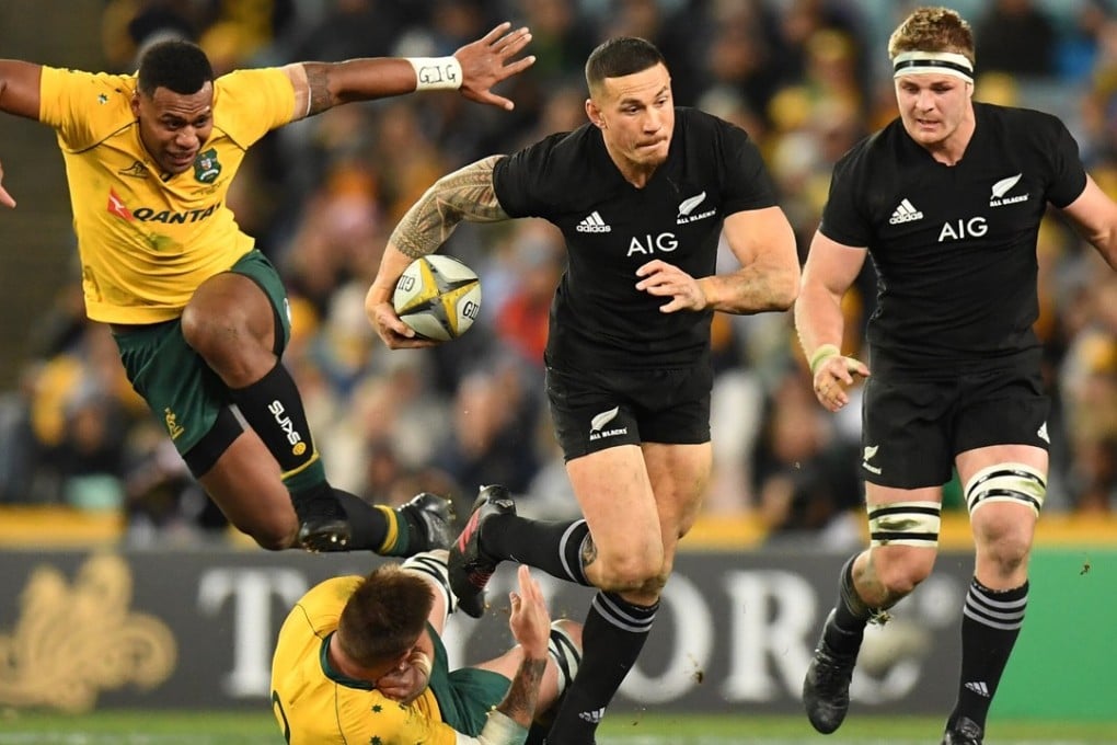 New Zealand’s Sonny Bill Williams steps through a tackle by Sean McMahon of Australia as Samu Kerevi of Australia leaps during game one of the Bledisloe Cup. Photos: EPA