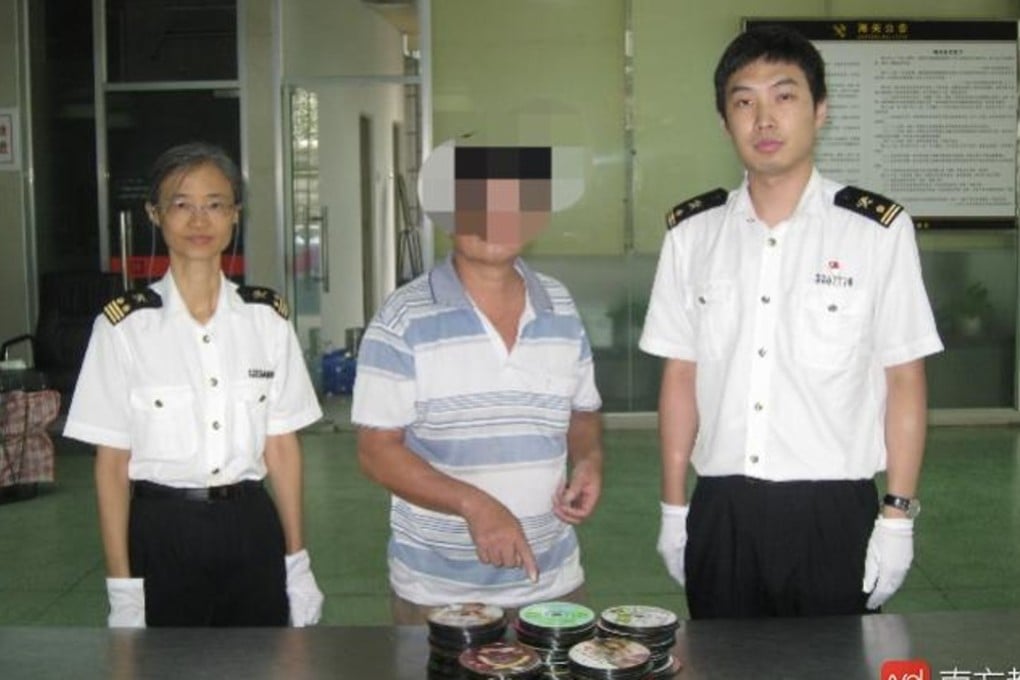 A Hong Kong man accused of trying to smuggle porn through an immigration checkpoint claimed he had found the discs in the street. Photo: Handout