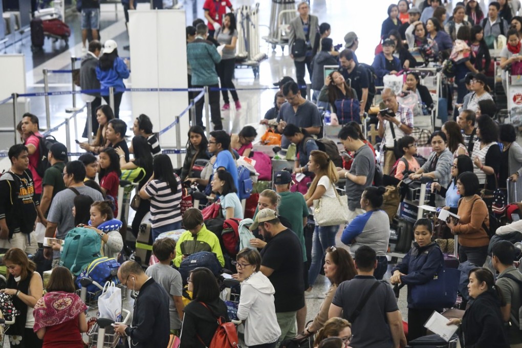 At the airport on Wednesday there were long lines of desperate travellers waiting to check in. Photo: K.Y. Cheng