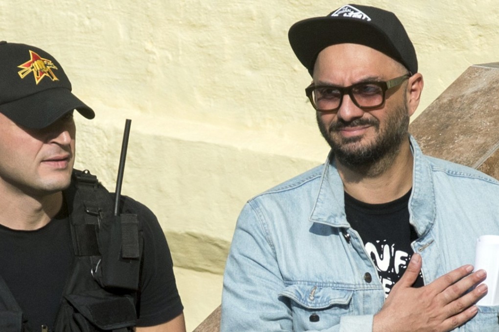 Russia's theatre and film director Kirill Serebrennikov, right, gestures to his heart at supporters after a hearing in a court in Moscow, Russia, on Wednesday, August 23, 2017. A Moscow court put the widely revered Serebrennikov under house arrest on charges of embezzling US$1.1 million, in a case widely seen as part of ongoing crackdown on freedom of expression in Russia. Photo: AP
