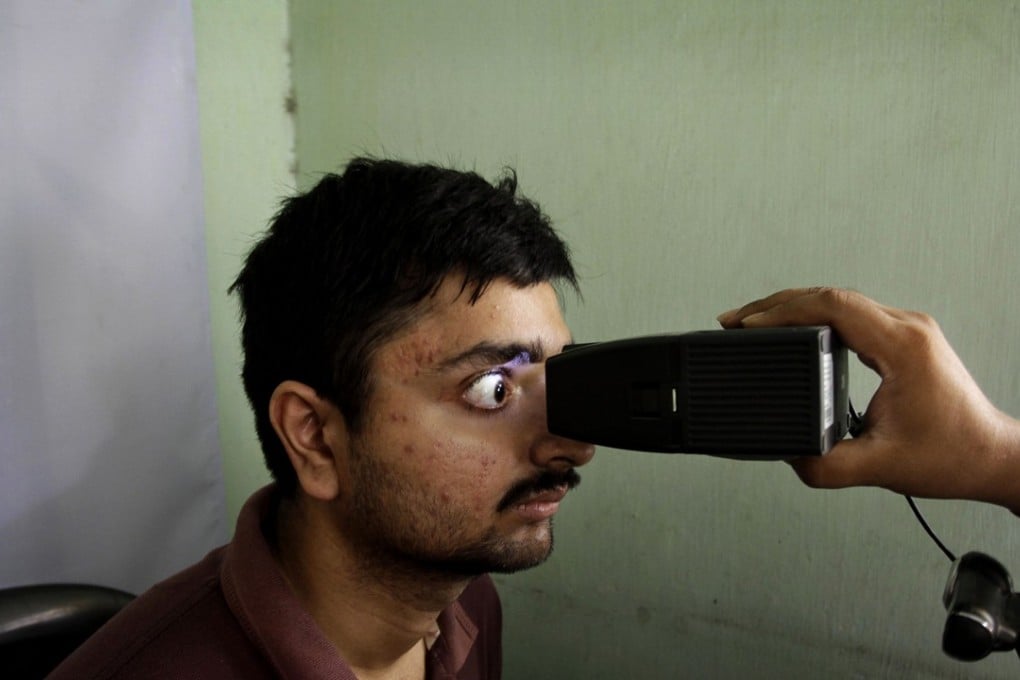 An Indian man gets his retina scanned as he enrols for Aadhar, India's unique identification project in Calcutta, India. File photo: AP