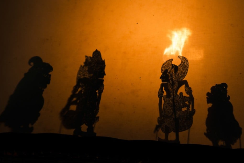 Many authentic Bali shadow puppet performances use firelight for illumination behind the screen. Photo: David Burden