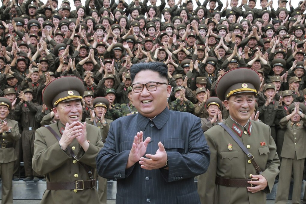 North Korean leader Kim Jong-un flanked by military officers. Photo: AP