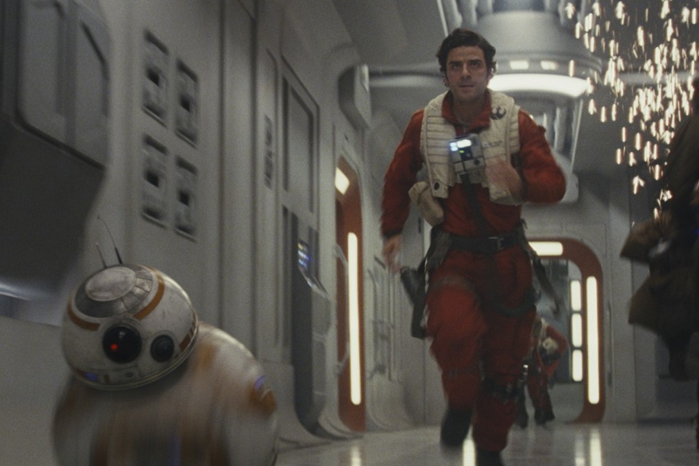 BB-8 (left) and Poe Dameron (Oscar Isaac) in a still from Star Wars: The Last Jedi. Photo: courtesy of Lucasfilm.
