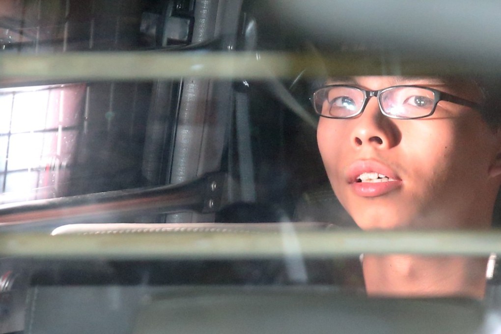 Joshua Wong Chi-fung escorted by Correctional Services Department officers after being sentenced to prison. Photo: K. Y. Cheng