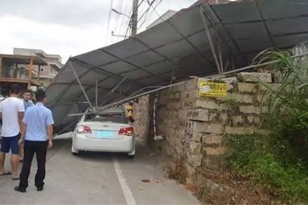 The giant advertising board was blown from the roof of an apartment building, police later discovered. Photo: Handout