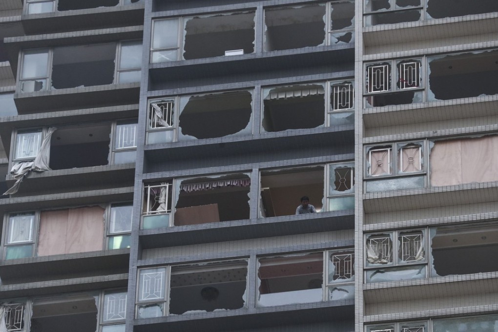 Broken windows on a residential building in Macau after Typhoon Hato hit the city. Photo: Edward Wong