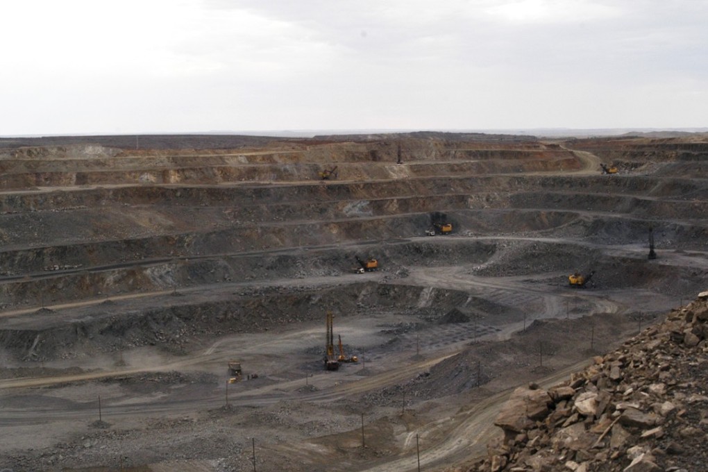 Workers use machinery to dig at a rare earth mine in the Baiyunebo mining district in Baotou, Inner Mongolia. China says it will improve safety legislation and strengthen mine inspections. Photo: AP