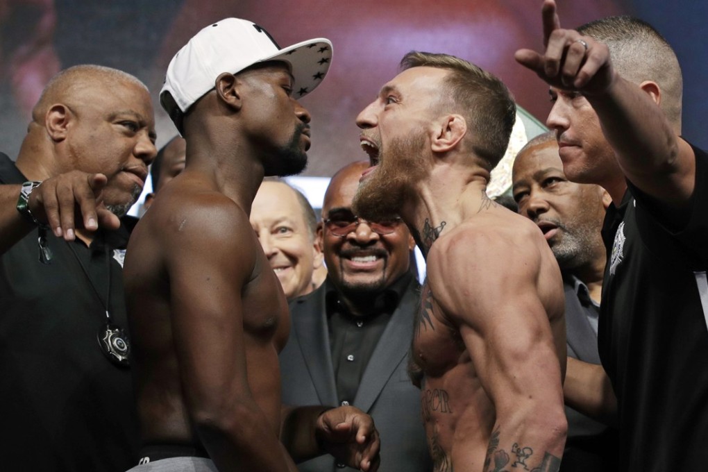 Floyd Mayweather (left) and Conor McGregor face off during the weigh-in. Photo: AP
