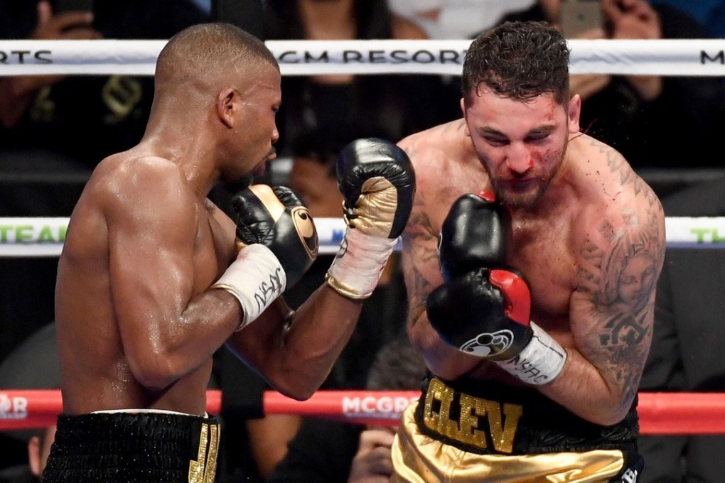 Badou Jack (left) throws a punch at Nathan Cleverly. Photo: AFP