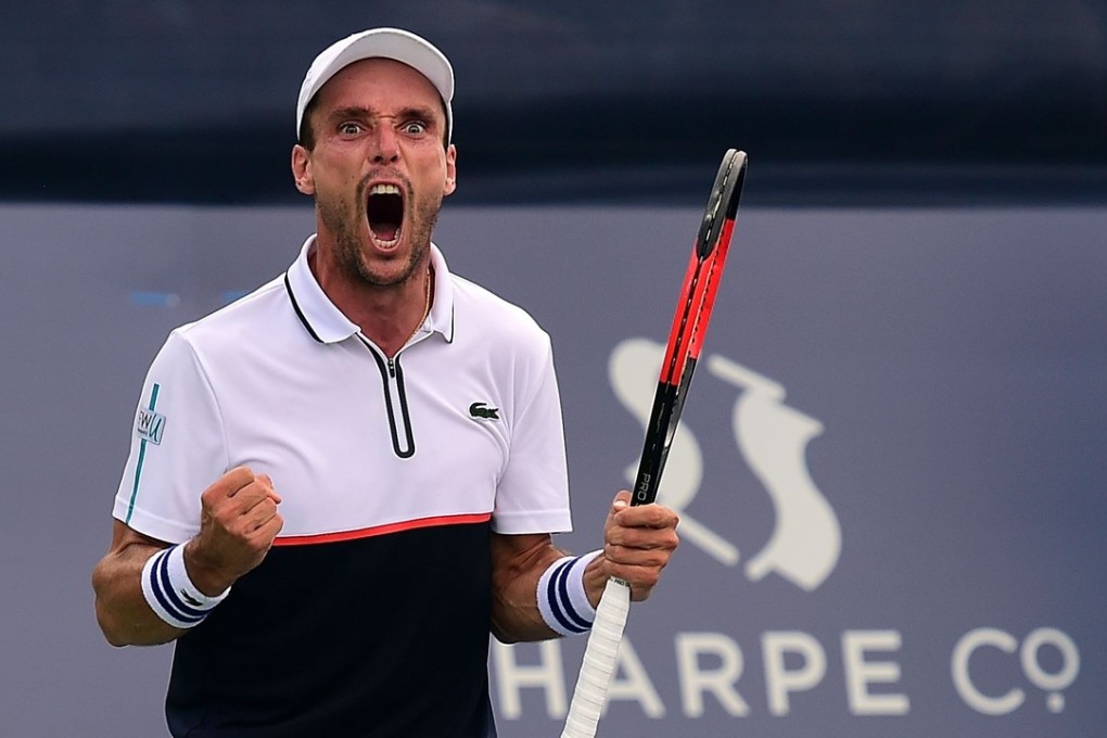Roberto Bautista Agut of Spain reacts as he defeats Damir Dzumhur of Bosnia and Herzegovina. Photos: AFP