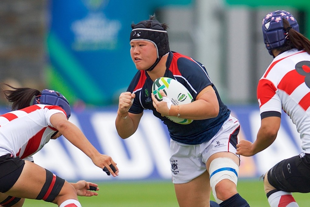Hong Kong front rower Lee Ka-shun surges forward during her side’s 44-5 loss to Japan in Belfast. Photos: HKRU