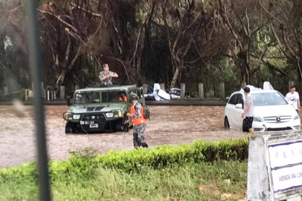 People's Liberation Army soldiers helping the stranded vehicle in Macau on Sunday. Photo: Facebook