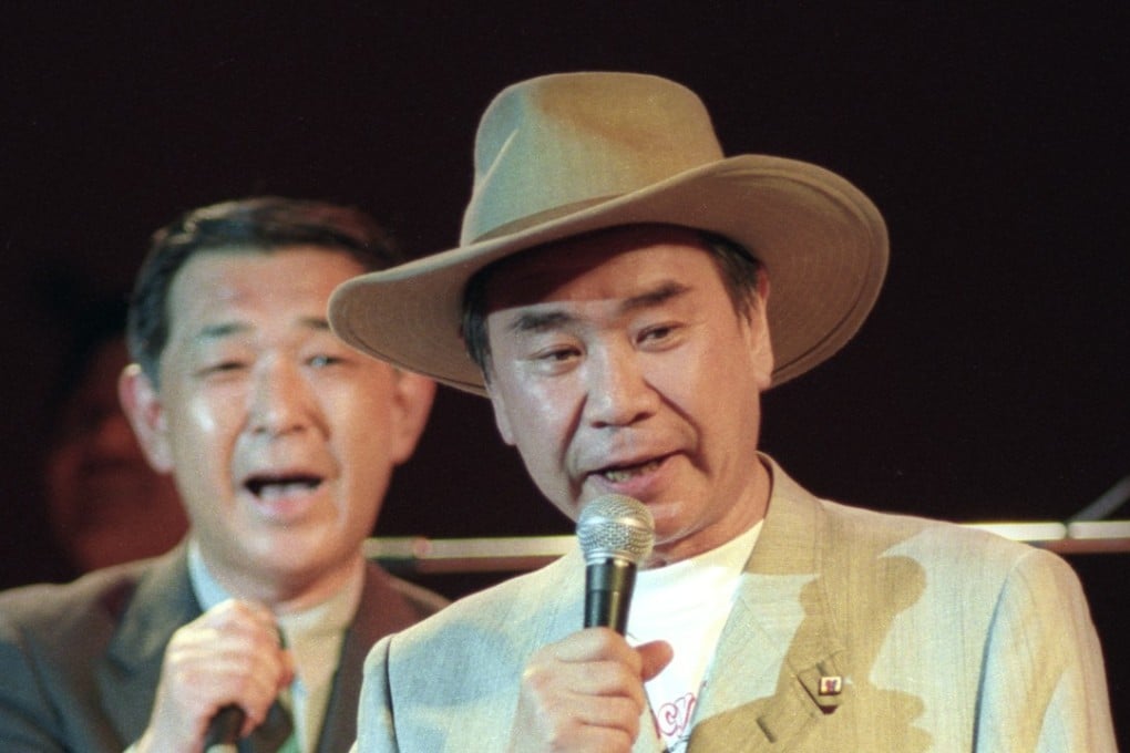 Tsutomu Hata sings a country western tune at a charity event in Tokyo in 1994. File photo: Kyodo