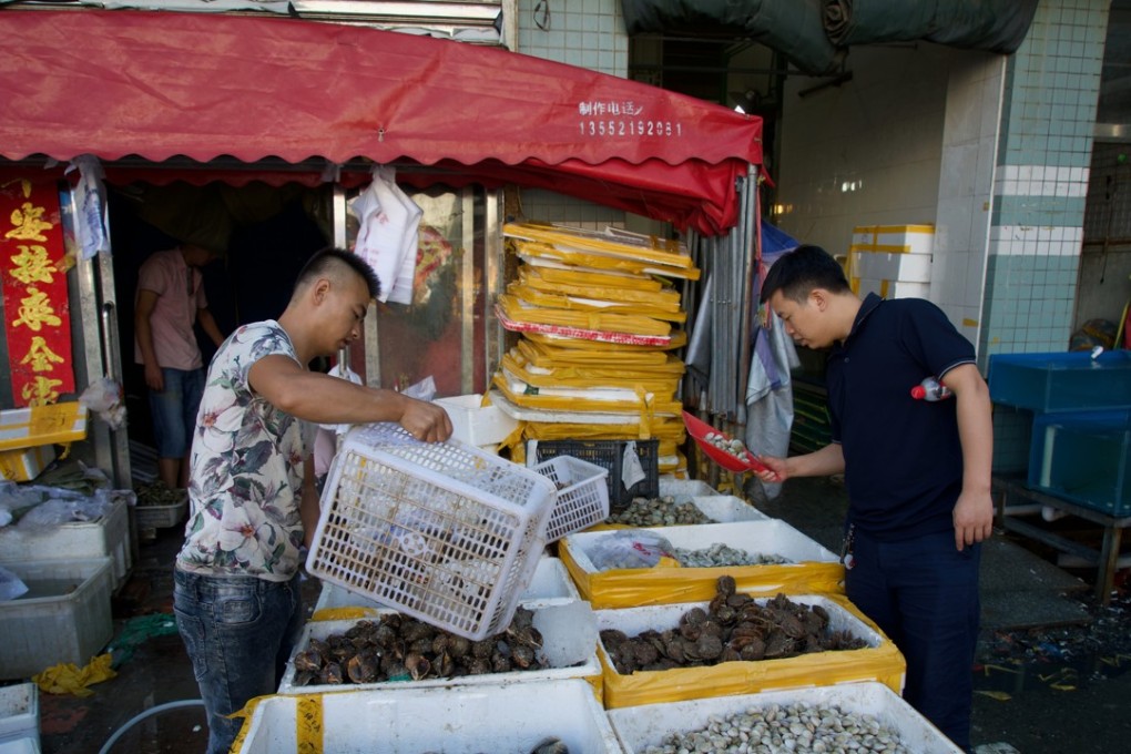 Beijing seafood vendor Feng Yalong said his business will be affected by the ban on imported seafood from North Korea. Photo: Handout.