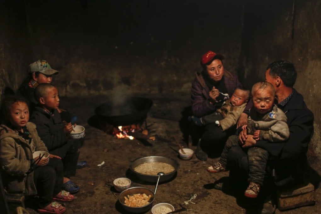 A poor family in Sichuan province have their evening meal. The Chinese government aims to lift all people above the poverty line by 2020. Photo: Imaginechina