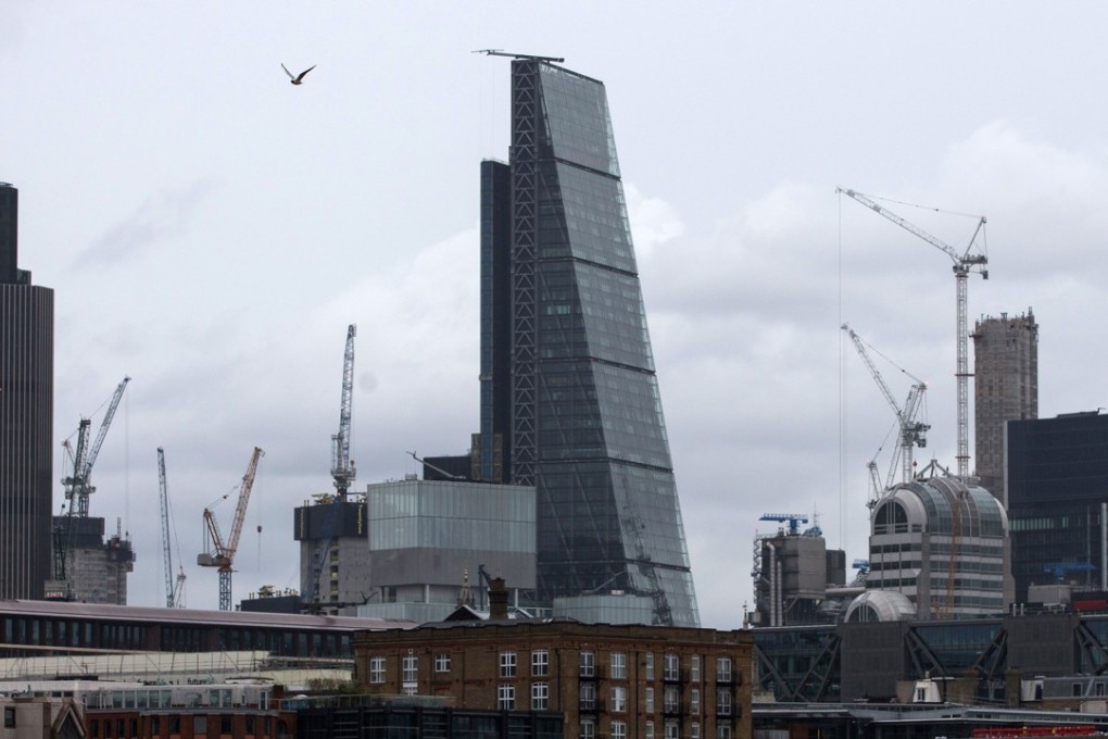 The Leadenhall Building (centre), also known as "The Cheesegrater", was bought for US$1.4 billion by Hong Kong’s CC Land in March, from its previous owner British Land, marking the largest ever Chinese purchase of British real estate. Photo: AFP
