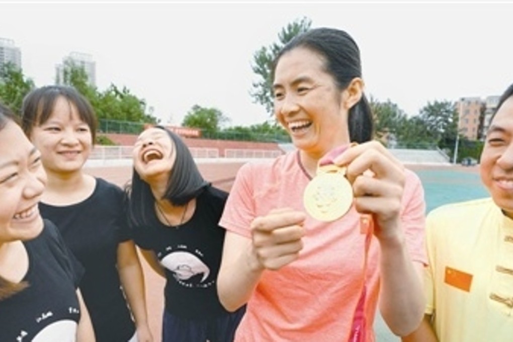 Huo Jinghong shows off her gold medal. Photo: Handout