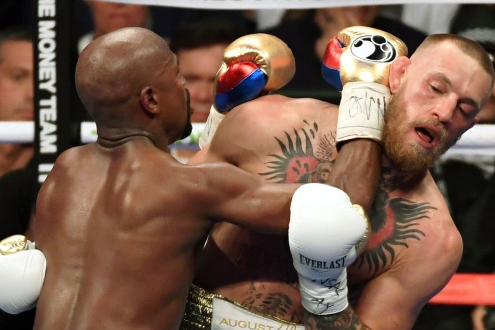 Floyd Mayweather Jnr (left) secured a 10th-round TKO victory against Conor McGregor. Photo: AFP