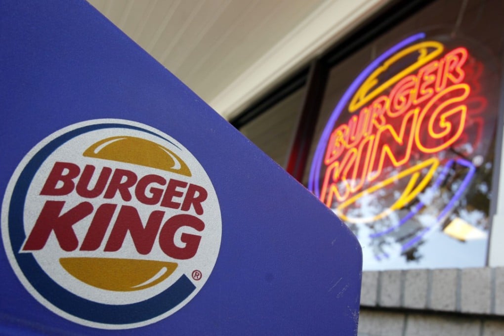 Company logos on display at a Burger King restaurant in Mountain View, Calif. Photo: AP Photo/Paul Sakuma