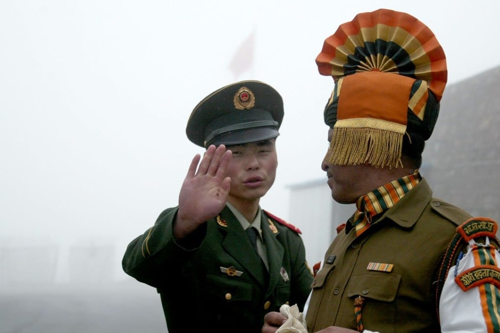 Chinese and Indian soldiers on the border in Sikkim state. Observers say the end of the stand-off was apparently timed to ease tensions ahead of a high-profile BRICS summit next week in China. Photo: AFP
