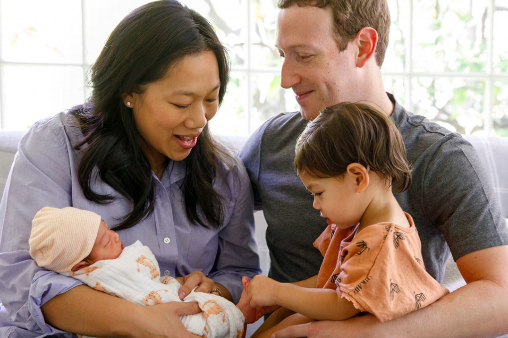 Priscilla Chan and Mark Zuckerberg with their children, August (left) and Max. Photo: Facebook