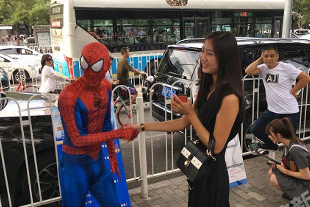 A live-streaming host, dressed as Spiderman, tries to woo a customer. Photo: Handout