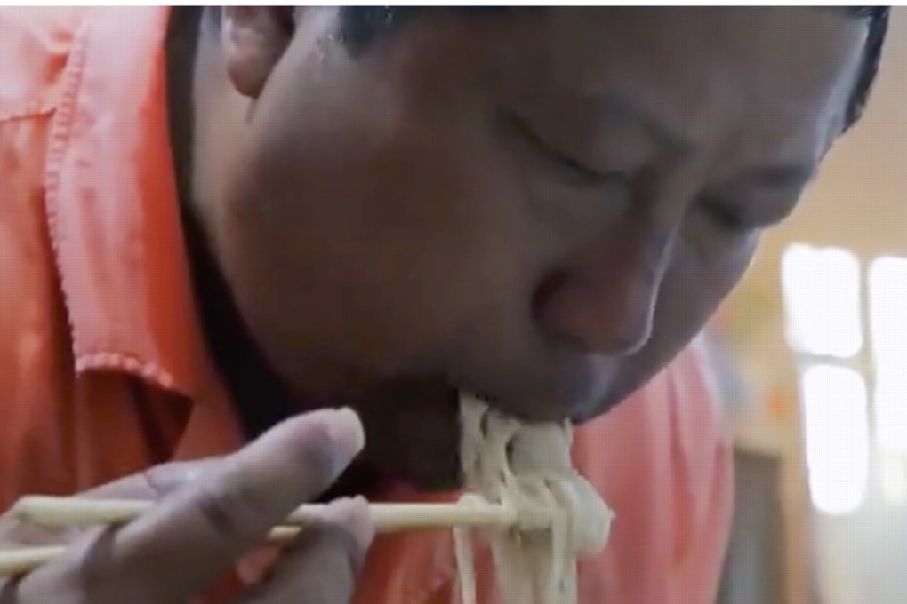 Devoted dad Hou tucks into a bowl of noodles. He said he was happy to make sacrifices to give his daughter the chance of a better life. Photo: Handout