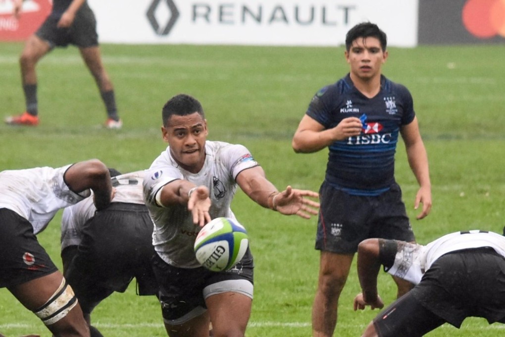 Hong Kong captain Mark Coebergh looks on as Fiji control the play. Photo: World Rugby
