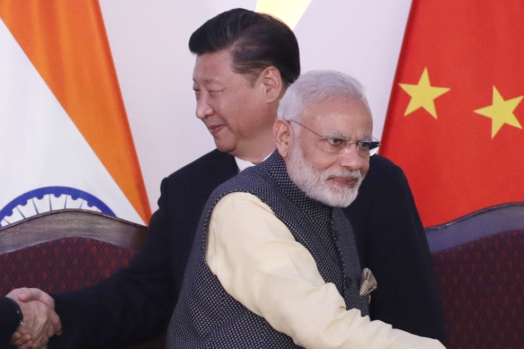 Chinese President Xi Jinping (left) and Indian Prime Minister Narendra Modi shake hands with leaders at last year’s BRICS summit in Goa, India. Photo: AP