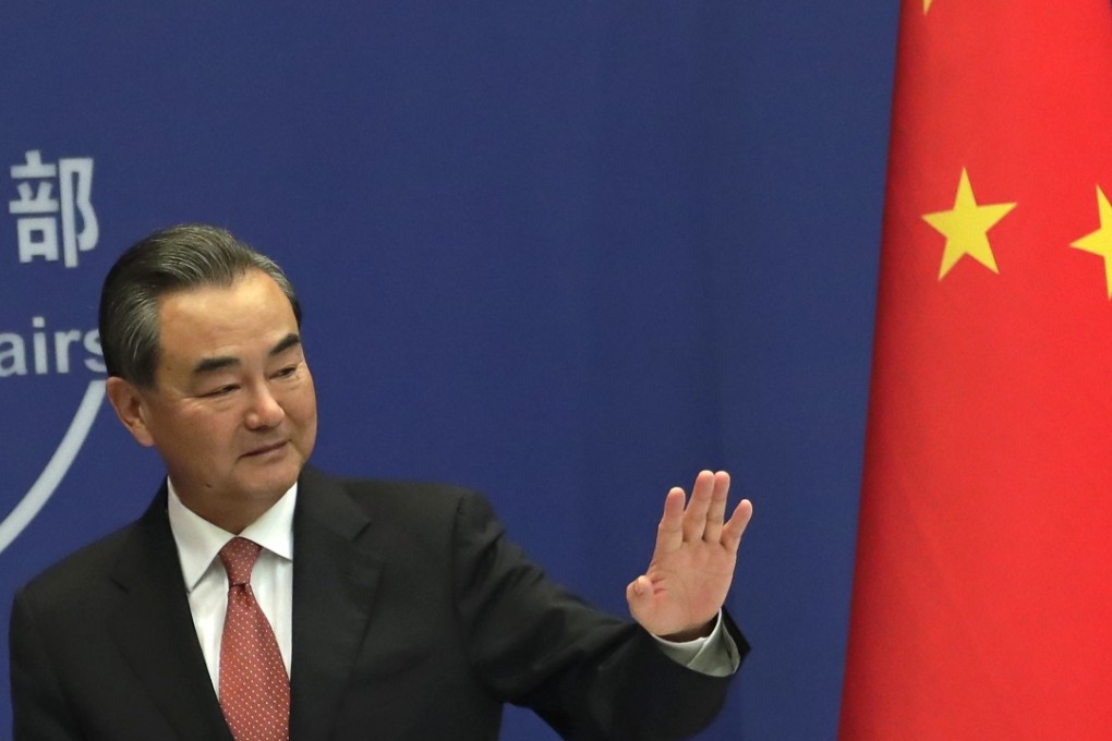 China’s Foreign Minister Wang Yi waves after a press conference at the Ministry of Foreign Affairs in Beijing on Wednesday. He said he hoped that India could “learn lessons” from a recently resolved border dispute. Photo: AP