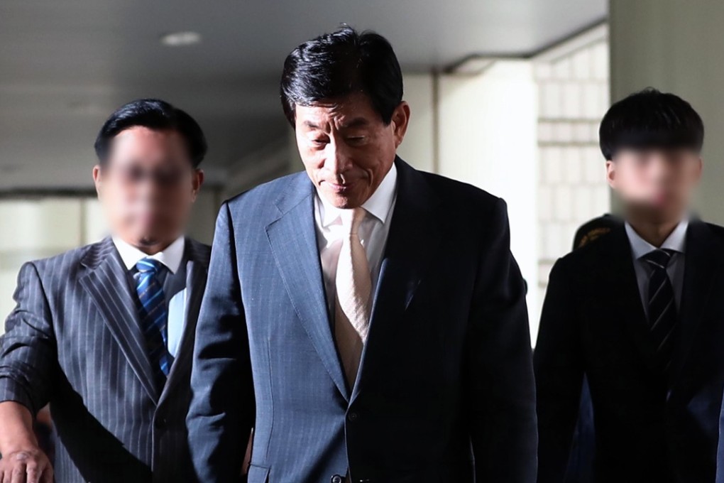 Won Sei-hoon, former director of the South Korean National Intelligence Agency, enters Seoul High Court on August 30, 2017. Photo: EPA/pixelated at source