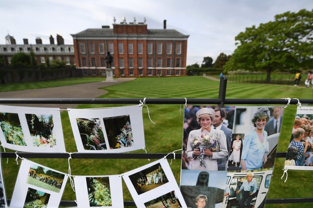 Tributes adorn the gates of Kensington Palace in London on Tuesday ahead of the 20th anniversary of the death of Diana, Princess of Wales. Photo: EPA