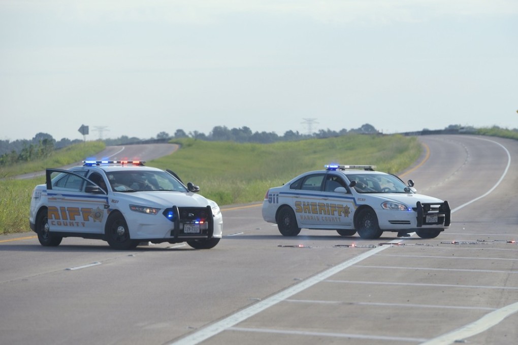 Harris County Sheriff vehicles block the road to the Arkema Chemical Plant in Crosby, Texas. Photo: AFP