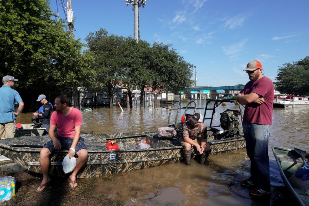 The sun finally came out as floodwaters recede as volunteers with boats wait to evacuate victims stuck in Tropical Storm Harvey’s floodwaters in western Houston. Photo: Reuters