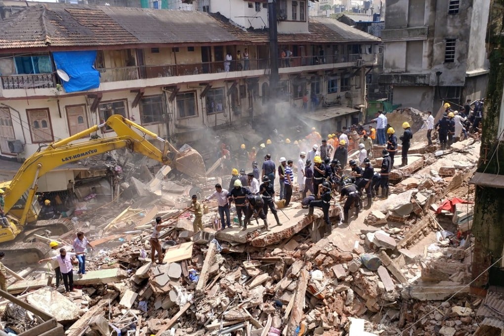 Firefighters and rescuers search for survivors at the site of a collapsed building in Mumbai. Photo: Reuters