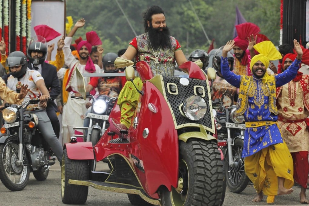 Indian guru Ram Rahim arrives for a press conference ahead of the release of his new film MSG: The Warrior Lion Heart, in New Delhi, India. Photo: AP
