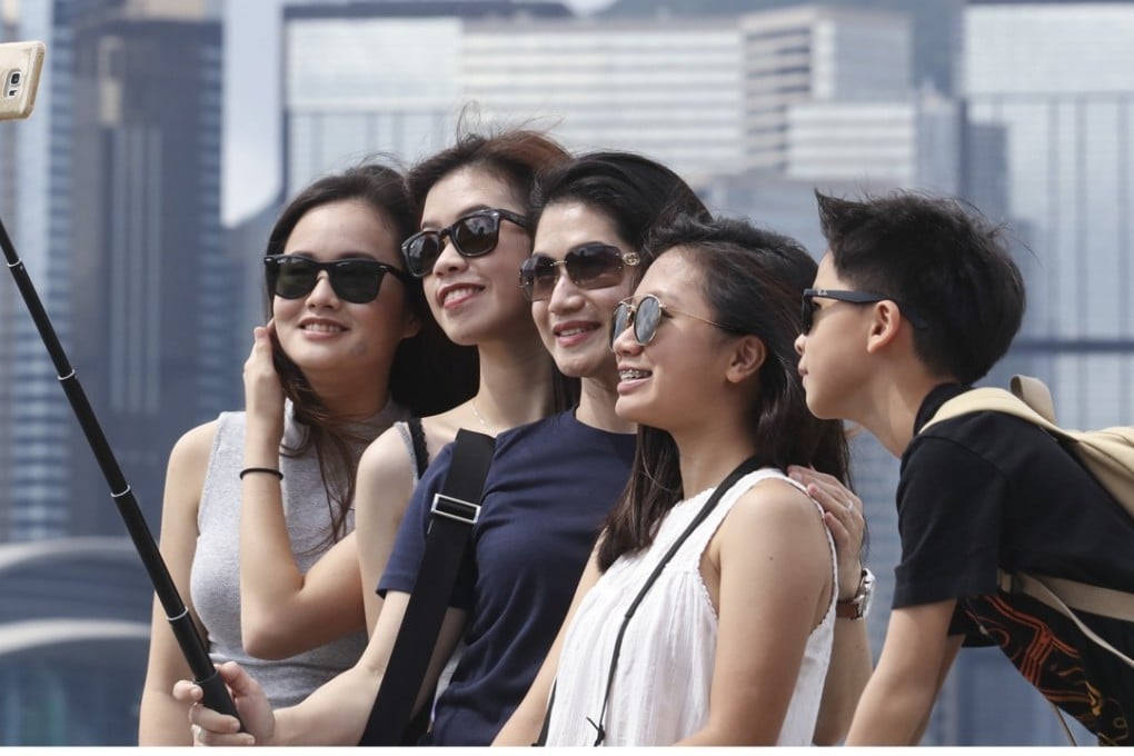Smartphones have increasingly doubled up as cameras for the vast majority of consumers, which in turn boosted the earnings of Chinese smartphone camera makers in the first-half of the year. Photo: Felix Wong