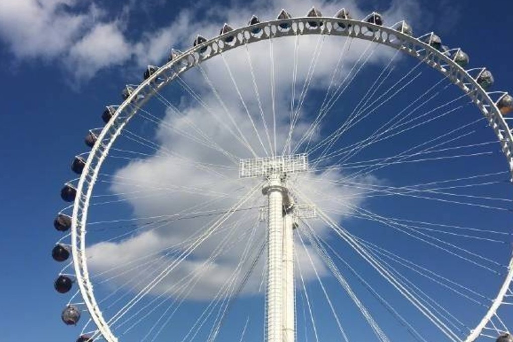 People were left hanging around for half an hour on Tuesday when a Ferris wheel at a Beijing theme park stopped working. Photo: Handout