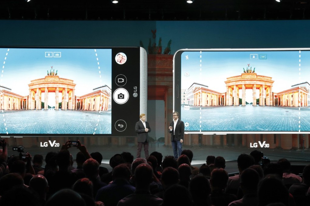 LG presents its new V30 premium smartphone (right) at the IFA in Berlin on Thursday. Photo: EPA