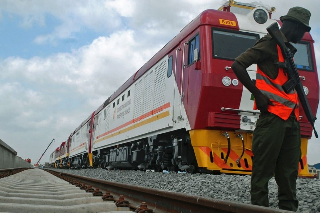 A security guard patrols during the launch of the first batch of Standard Gauge Railway (SGR) freight locomotives at the port in Mombasa last January. The SGR system, the biggest infrastructure project in Kenya since independence, is being built by the state-owned China Road and Bridge Corporation, with plans to connect Kenya, Uganda, Rwanda and South Sudan to Mombasa. Photo: AFP