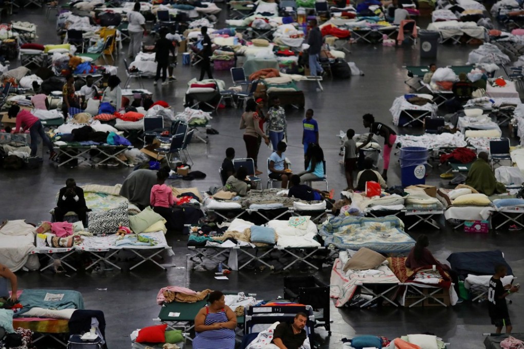 Evacuees affected by Tropical Storm Harvey take shelter at the George R. Brown Convention Centre in downtown Houston, Texas, on Thursday. Photo: Reuters